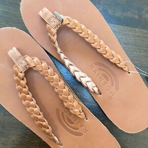 Rainbow double braid or twisted sister flip flops. Color is tan